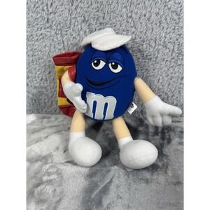 This is a plush toy of the Blue M&M's character.